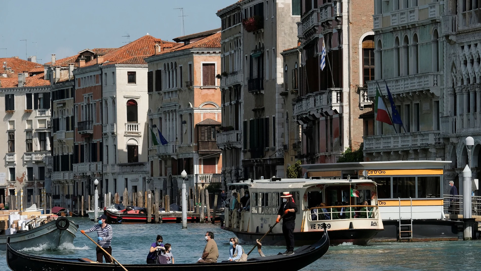 Gondoliers resume their service on the Grand Canal as Italy eases some more of the lockdown measures put in place during the coronavirus disease (COVID-19) outbreak, in Venice