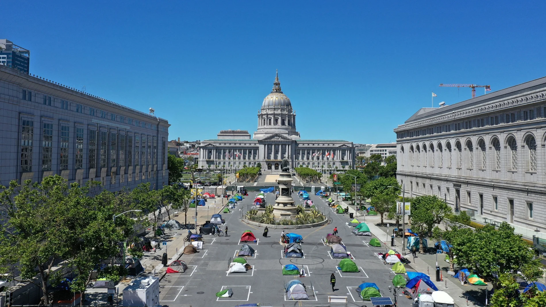 Tents are pitched using social distancing to help slow the spread of coronavirus disease (COVID-19) at a homeless encampment in a square next to city hall in San Francisco