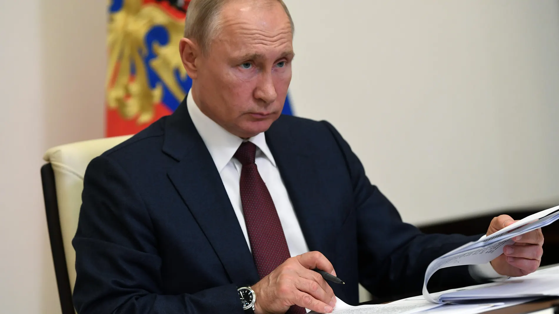 Russian President Vladimir Putin attends teleconference call