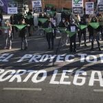 Pro-choice activists hold the iconic green handkerchiefs in favor of decriminalizing abortion as they protest outside Congress during a government-ordered lockdown to curb the spread of the coronavirus in Buenos Aires, Argentina, Thursday, May 28, 2020. (AP Photo/Natacha Pisarenko)