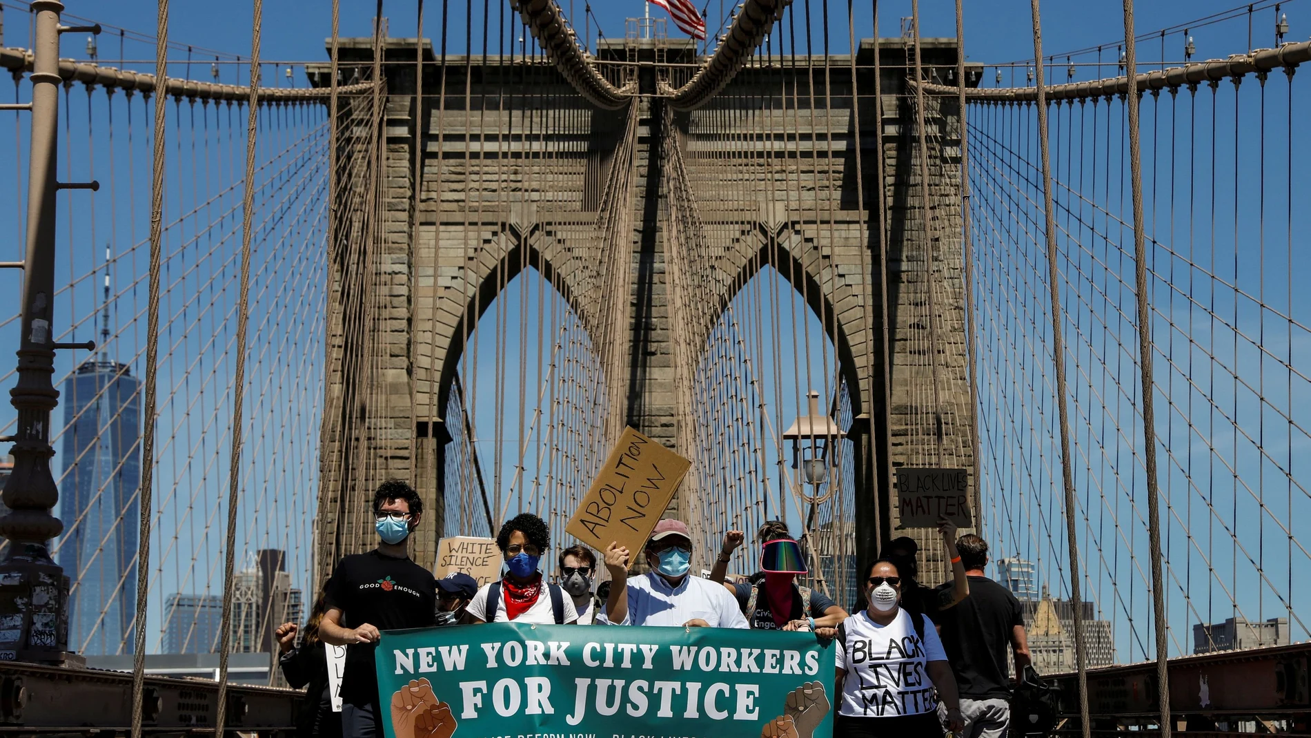 Current and former New York City Mayor's staff march across the Brooklyn Bridge to call for reforms during a protest against racial inequality in the aftermath of the death in Minneapolis police custody of George Floyd, in New York
