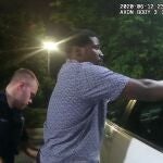 Former Atlanta Police Department officer Garrett Rolfe searches 27-year-old Rayshard Brooks in a Wendy's restaurant parking lot in a still image from the video body camera of officer Devin Bronsan in Atlanta, Georgia, U.S. June 12, 2020. Video taken June 12, 2020. Atlanta Police Department/Handout via REUTERS. THIS IMAGE HAS BEEN SUPPLIED BY A THIRD PARTY.