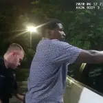 Former Atlanta Police Department officer Garrett Rolfe searches 27-year-old Rayshard Brooks in a Wendy&#39;s restaurant parking lot in a still image from the video body camera of officer Devin Bronsan in Atlanta, Georgia, U.S. June 12, 2020. Video taken June 12, 2020. Atlanta Police Department/Handout via REUTERS. THIS IMAGE HAS BEEN SUPPLIED BY A THIRD PARTY.