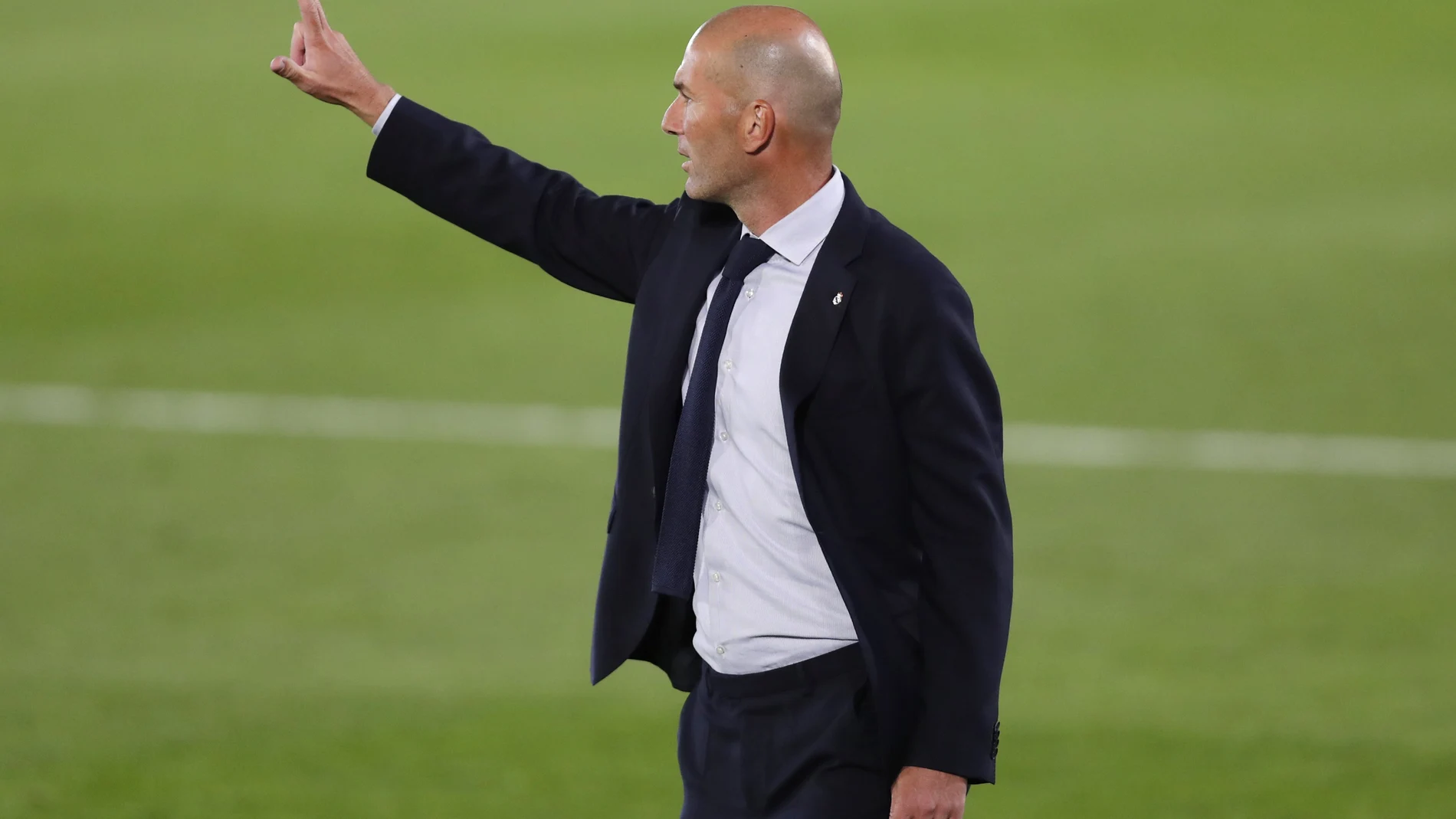 Real Madrid's head coach Zinedine Zidane gives instructions during the Spanish La Liga soccer match between Real Madrid and Valencia at Alfredo di Stefano stadium in Madrid, Spain, Thursday, June 18, 2020. (AP Photo/Manu Fernandez)