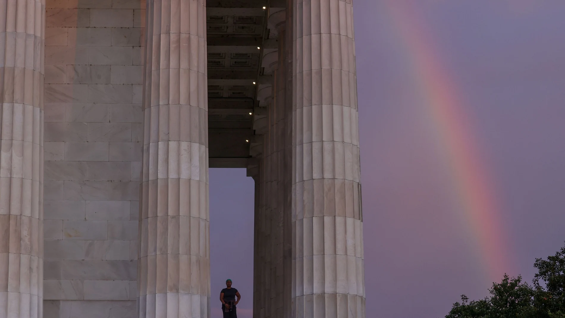 A rainbow appears behind the Lincoln Memorial as Fitzpatrick prepares to begin her day, coincidentally Juneteenth, with a sunrise walk in Washington
