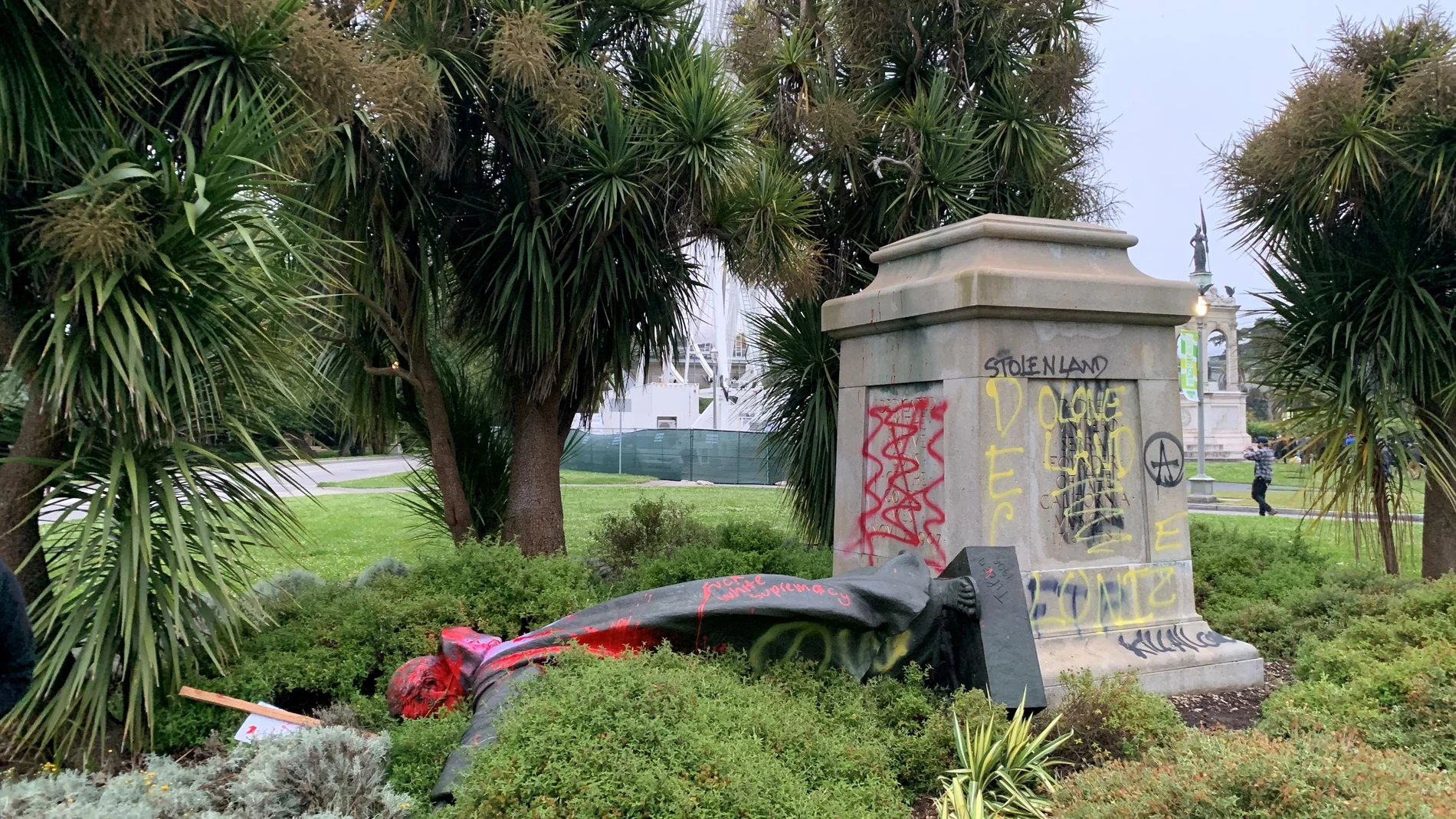 St Junipero Serra statue faces the ground memorial after being vandalised with red spray painting San Francisco