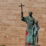 A statue of Fray Junipero Serra is seen covered with red paint in Palma de Mallorca