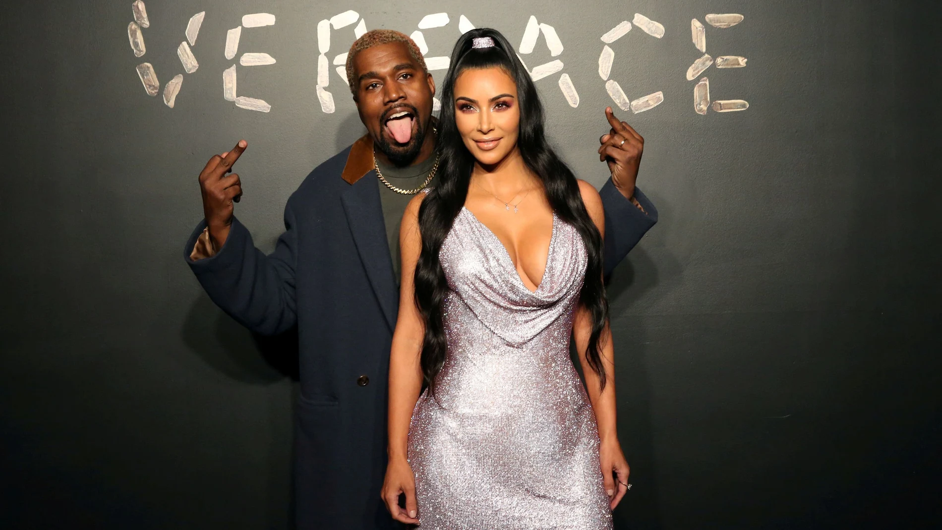 FILE PHOTO: Kanye West and Kim Kardashian pose for a photo before attending the Versace presentation in New York