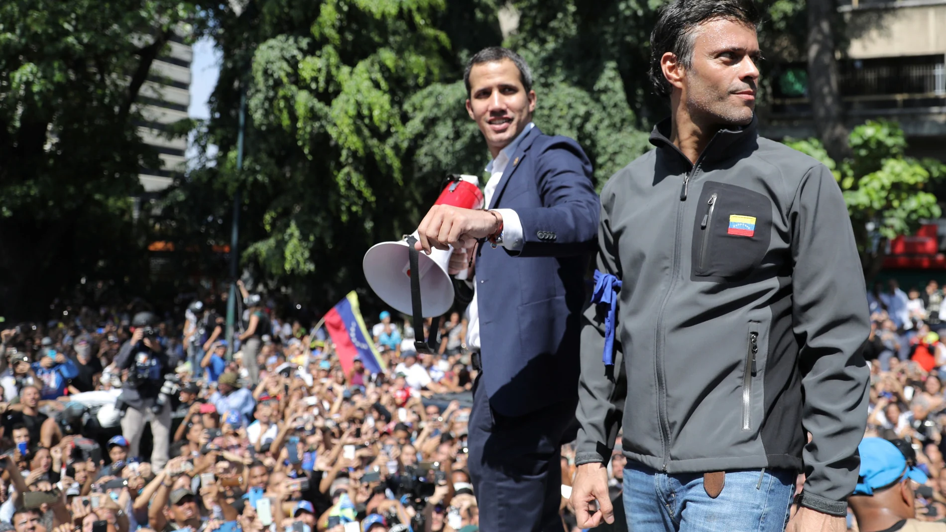Venezuelan opposition leader Juan Guaido, who many nations have recognised as the country's rightful interim ruler and fellow opposition leader Leopoldo Lopez address a crowd of supporters in Caracas.