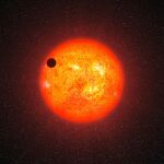 Representación artística del exoplaneta GJ 1214b pasando frente a su estrella roja. Este está a 40 años luz de nosotros y no está relacionado con el presente artículo.