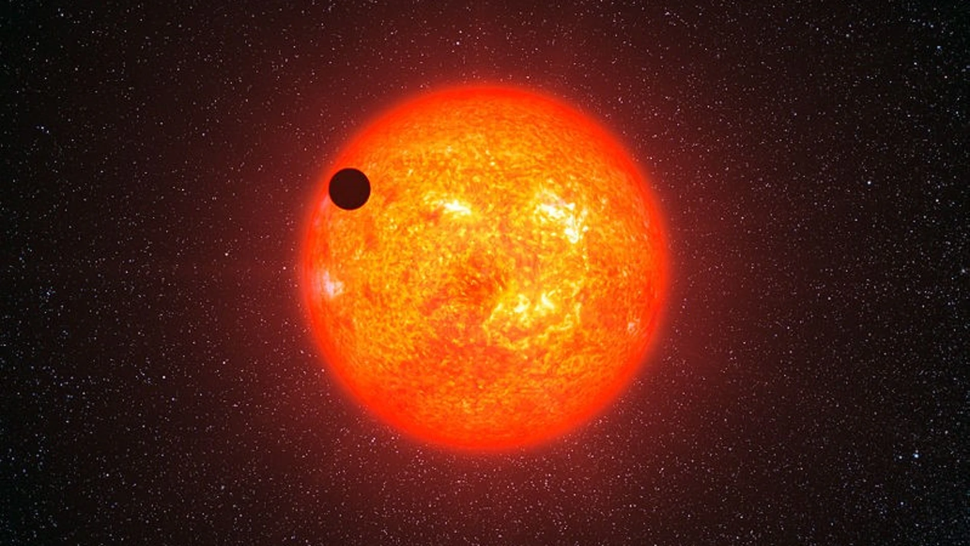 Representación artística del exoplaneta GJ 1214b pasando frente a su estrella roja. Este está a 40 años luz de nosotros y no está relacionado con el presente artículo.