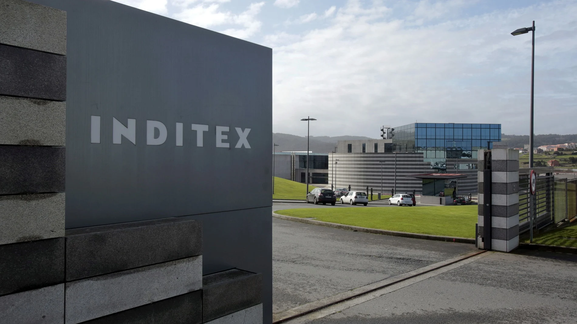 FILE PHOTO: An Inditex logo is seen at the entrance of a Zara factory, the headquarters of Inditex group, in Arteixo