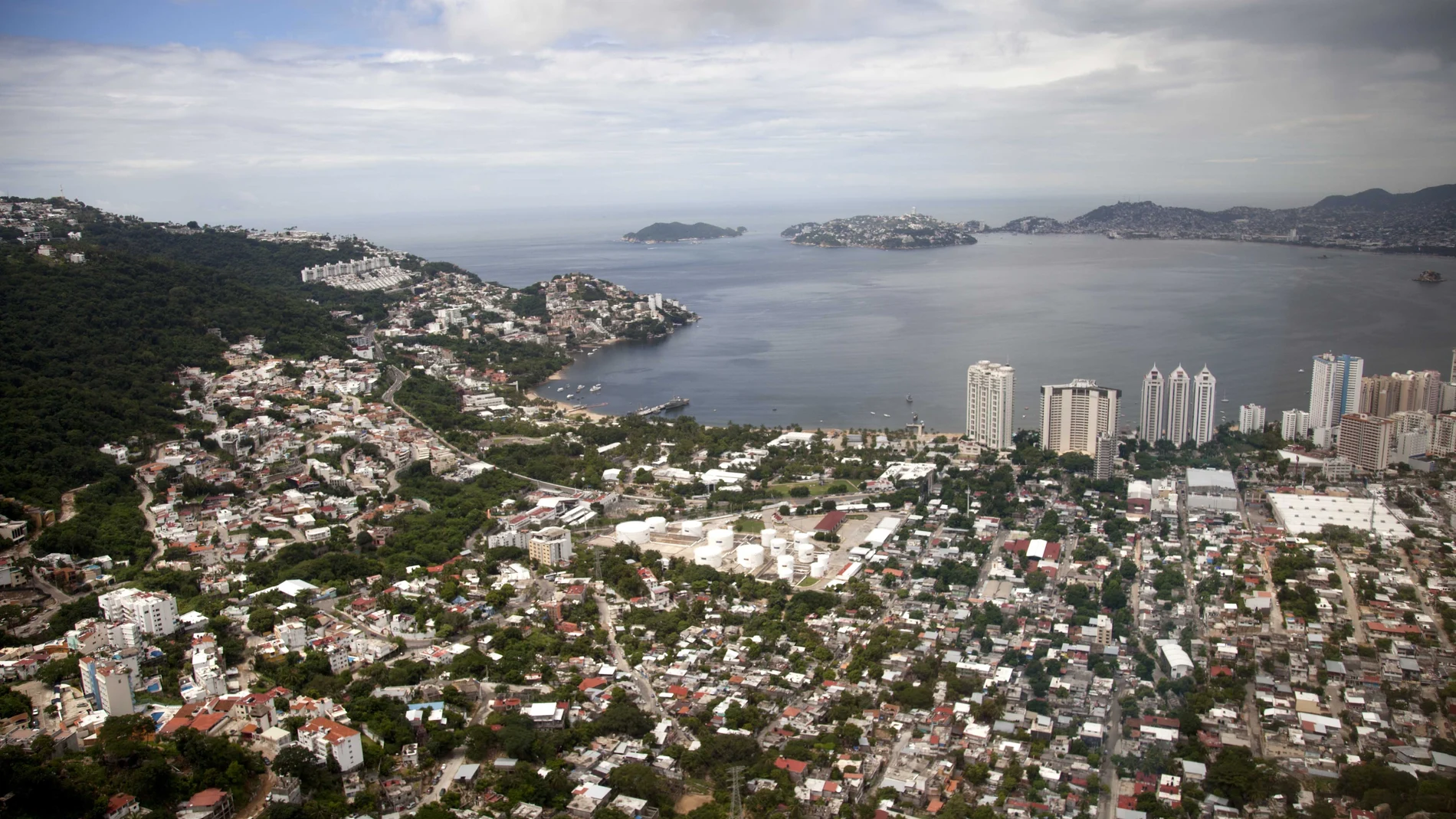 FILE - This Sept. 20, 2013 file photo shows an aerial view of the Pacific resort city of Acapulco, Mexico. The Mexican coastal city pulled a pair of controversial video ads Thursday, Aug. 6, 2020, touting the faded resortâ€™s reputation as an â€œanything goesâ€ tourism destination because they weren't appropriate during the new coronavirus pandemic. (AP Photo/Eduardo Verdugo, File)