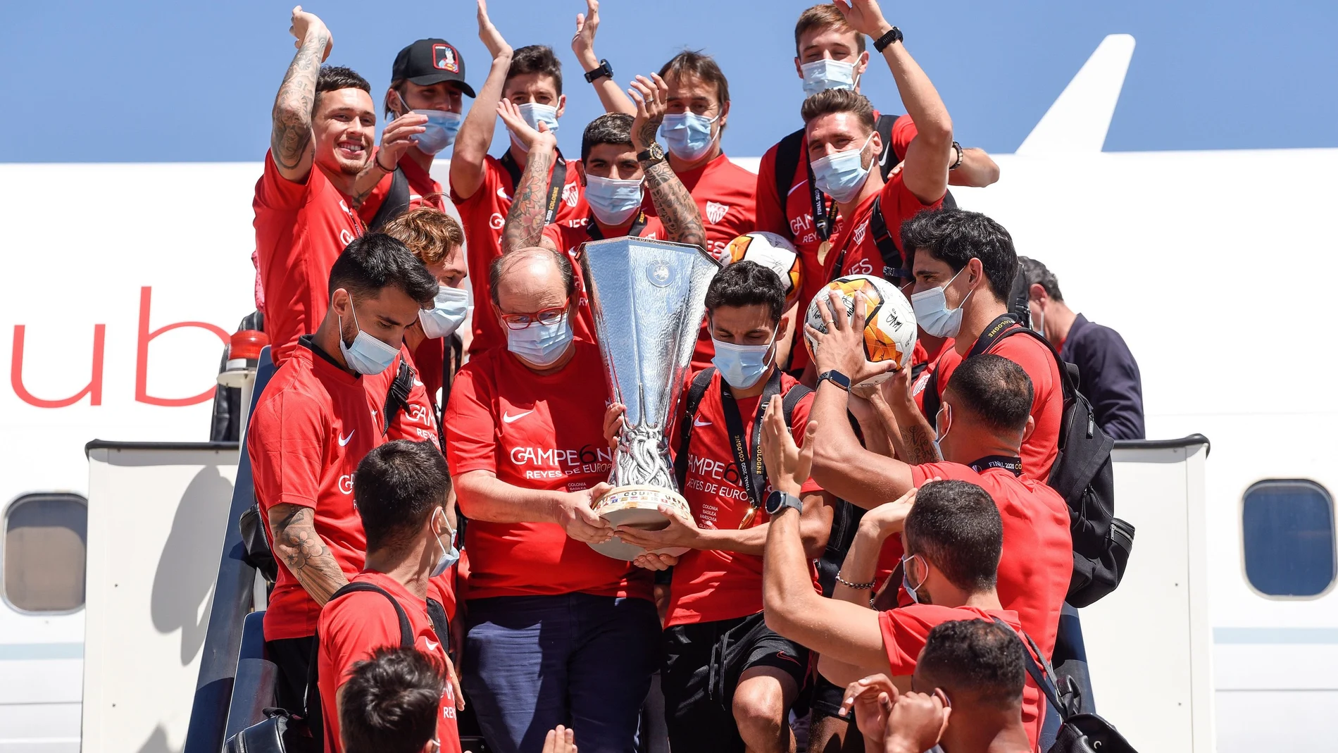 Sevilla with the trophy as they arrive back in Seville after winning the Europa League