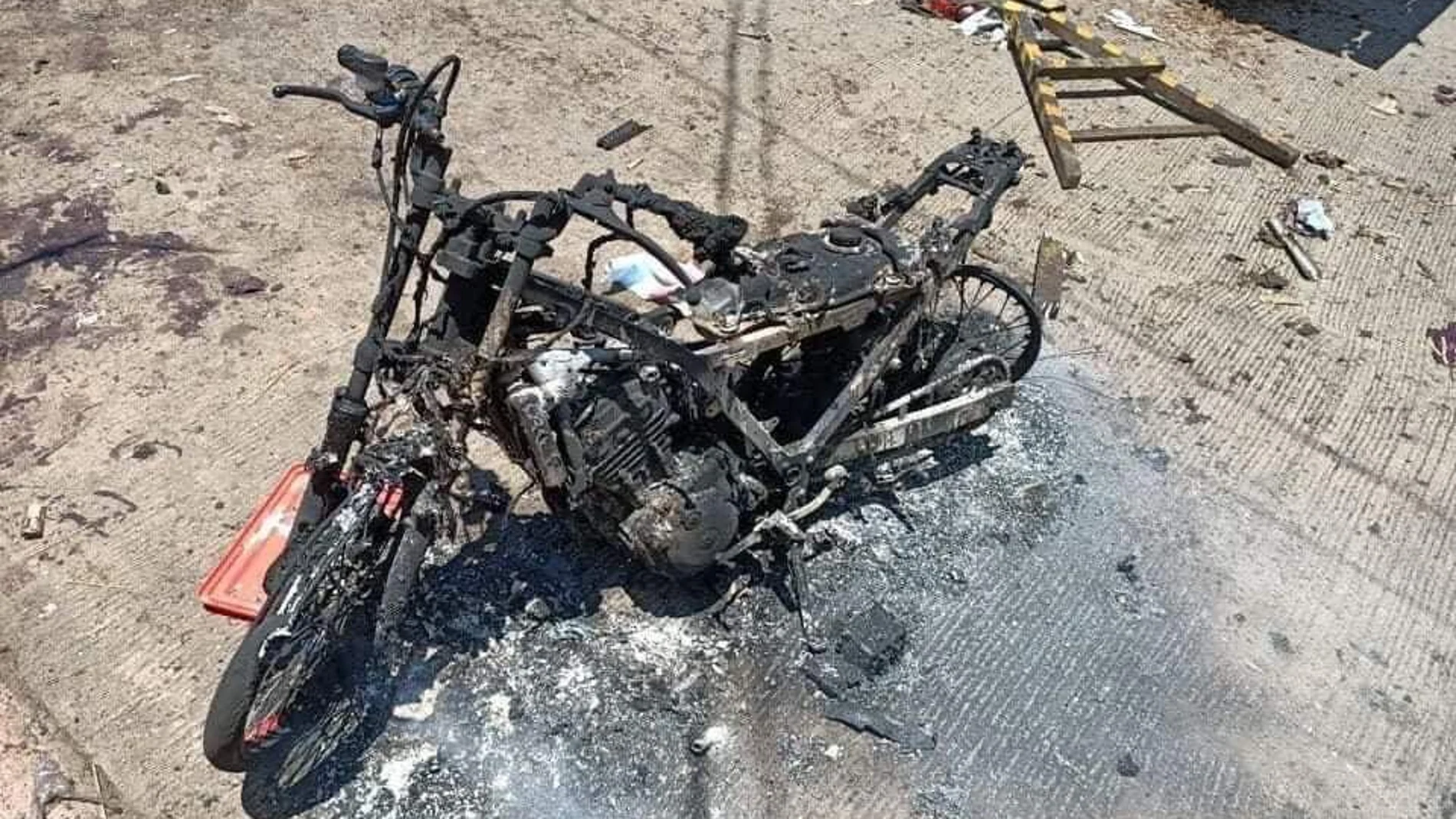 Burned motorcycle is pictured in the aftermath of an explosion in Jolo Island