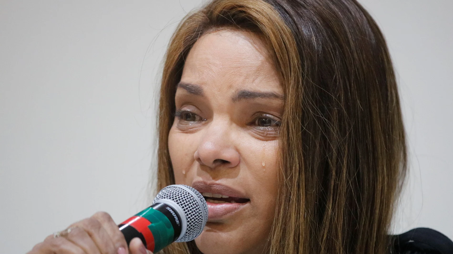 Brazilian Congresswoman Flordelis de Souza reacts as she talks about her husband, pastor Anderson do Carmo, who was shot more than 30 times at their home, in Brasilia