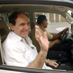 FILE - In this April 27, 2005 file photo, Ecuador's former President Abdala Bucaram waves as he leaves the Foreign Ministery in Panama City, where he sought political asylum after fleeing his country. Bucaramâ€™s lawyer Cristian Romero said on Wednesday, Aug. 26, 2020, that the former president has suffered a heart attack and is interned at a clinic in Guayaquil where he will undergo open heart surgery. (AP Photo/Arnulfo Franco, File)