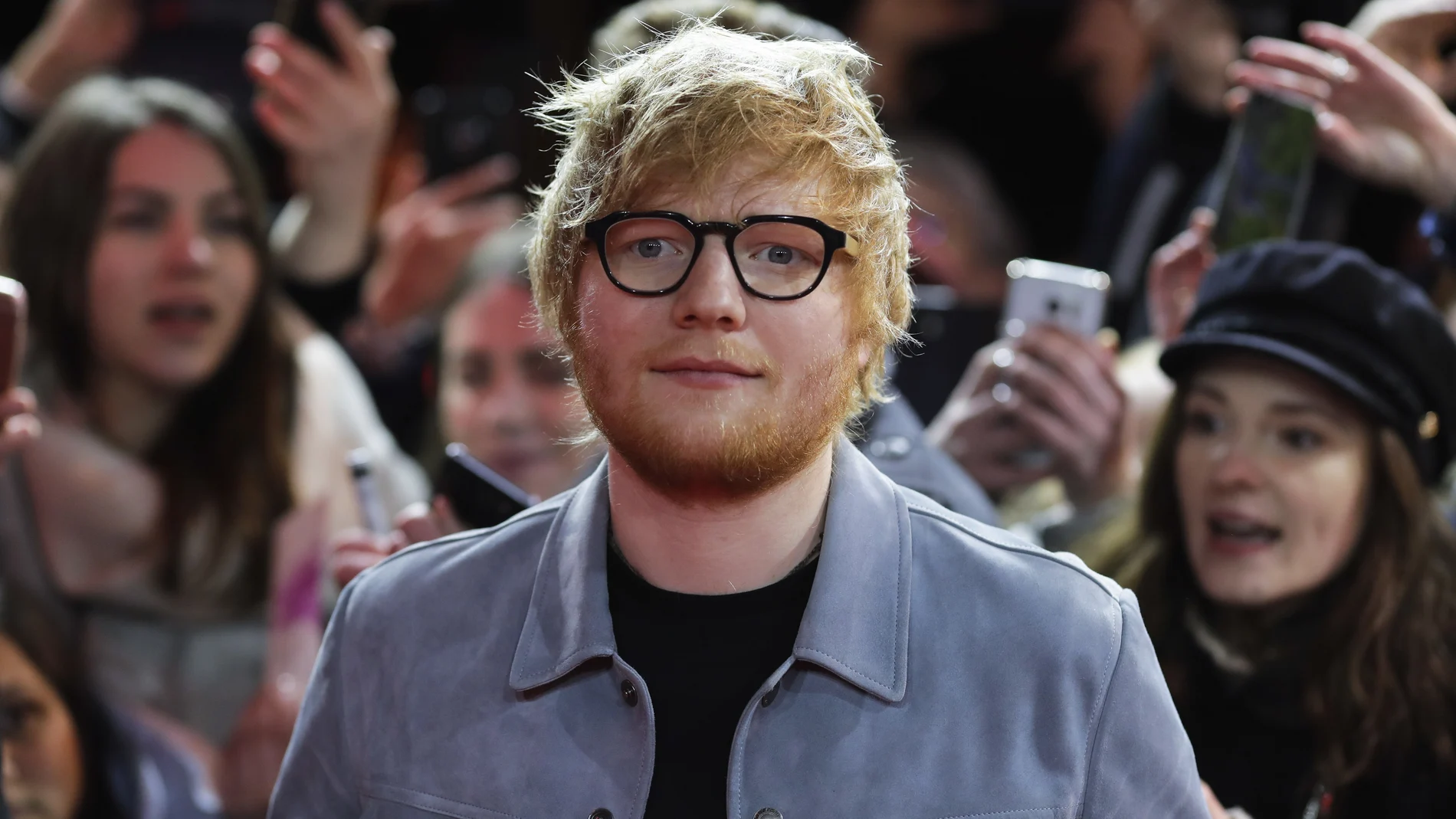 FILE - In this Friday, Feb. 23, 2018 file photo, singer-songwriter Ed Sheeran, center, arrives for the screening of the film 'Songwriter' during the 68th edition of the International Film Festival Berlin, Berlinale, in Berlin, Germany. Ed Sheeran and his wife Cherry have announced the birth of their daughter Lyra Antarctica Seaborn Sheeran. The singer-songwriter said in an Instagram post that the coupleâ€™s â€œbeautiful and healthy daughterâ€ was born last week. (AP Photo/Markus Schreiber, File)