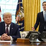 President Donald Trump listens as Jared Kushner speaks in the Oval Office of the White House on Friday, Sept. 11, 2020, in Washington. (AP Photo/Andrew Harnik)