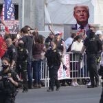 President Donald Trump supporters gather outside Walter Reed National Military Medical Center in Bethesda, Md., Sunday, Oct. 4, 2020. Trump was admitted to the hospital after contracting COVID-19. (AP Photo/Anthony Peltier)