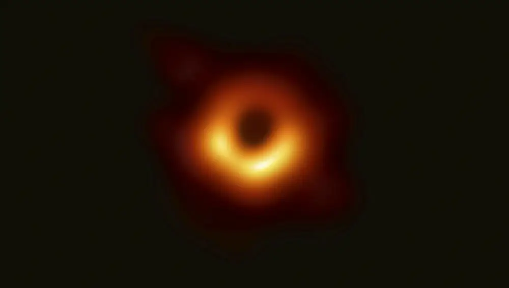 This image provided Wednesday, April 10, 2019, by Event Horizon Telescope, shows a black hole. Scientists revealed the first image ever made of a black hole after assembling data gathered by a network of radio telescopes around the world. Three scientists won the Nobel Prize in physics Tuesday, Oct. 6, 2020, for establishing the all-too-weird reality of black holes. Roger Penrose of Britain, Reinhard Genzel of Germany and Andrea Ghez of the United States explained to the world these dead ends of the cosmos that are still not completely understood but are deeply connected, somehow, to the creation of galaxies. (Event Horizon Telescope Collaboration/Maunakea Observatories via AP)