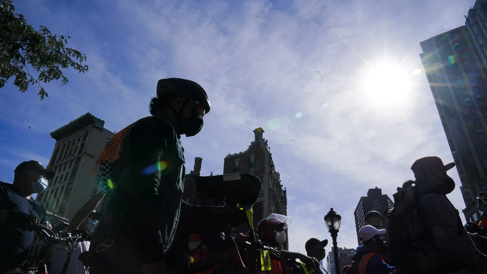 Bicycle delivery workers for restaurants and food applications protest to demand more protection during a wave of robberies of their electrical bicycles Thursday, Oct. 15, 2020, in New York. (AP Photo/Frank Franklin II)