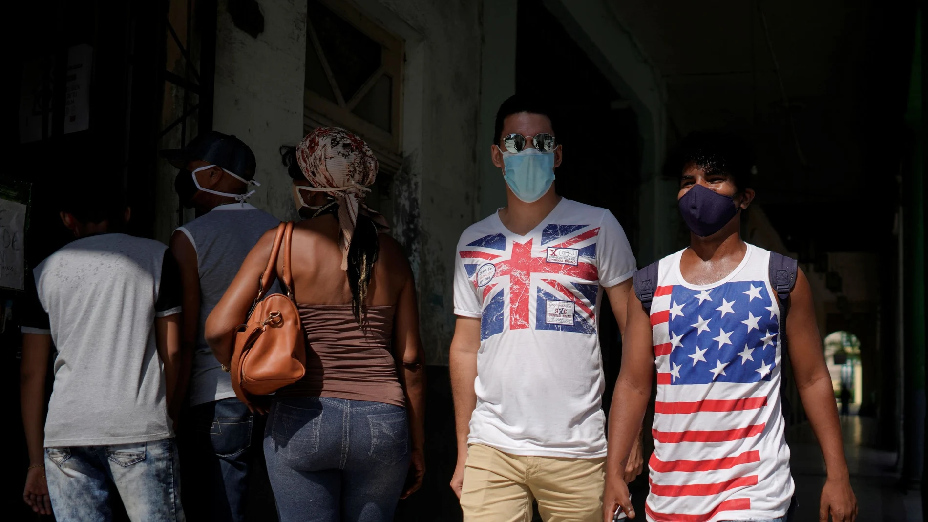 People wear T-shirts with Union Jack and a U.S. flag in downtown Havana, Cuba, October 31, 2020. Picture taken October 31, 2020. REUTERS/Alexandre Meneghini