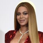 FILE - In this Feb. 12, 2017 file photo, Beyonce poses in the press room at the 59th annual Grammy Awards in Los Angeles. The pop star scored multiple Grammy nominations Tuesday, making her the leading contender with nine nominations. (Photo by Chris Pizzello/Invision/AP, File)