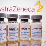 Vials with a sticker reading, "COVID-19 / Coronavirus vaccine / Injection only" and a medical syringe are seen in front of a displayed AstraZeneca logo in this illustration taken October 31, 2020. REUTERS/Dado Ruvic/Illustration