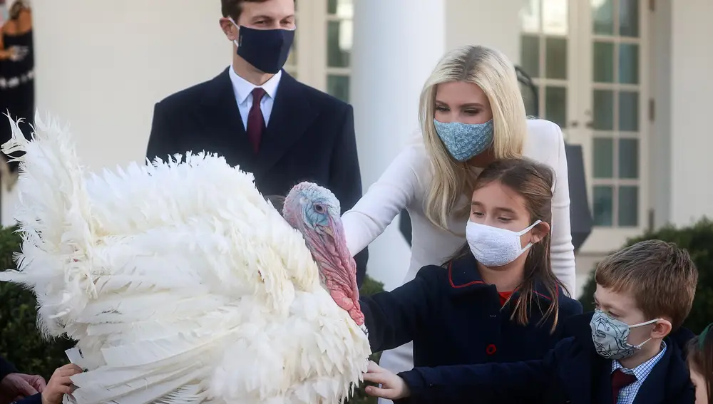 White House senior advisors Jared Kushner and Ivanka Trump, and their daughter Arabella Kushner gather around &quot;Corn&quot; during the presentation (and pardoning) of the 73rd National Thanksgiving Turkey in the Rose Garden at the White House in Washington, U.S., November 24, 2020. Picture taken November 24, 2020. REUTERS/Hannah McKay