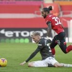 Southampton's Theo Walcott and Manchester United's Eric Bailly, left, vie for the ball during an English Premier League soccer match between Southampton and Manchester United at the St. Mary's stadium in Southampton, England, Sunday, Nov. 29, 2020. (Mike Hewitt, Pool via AP)