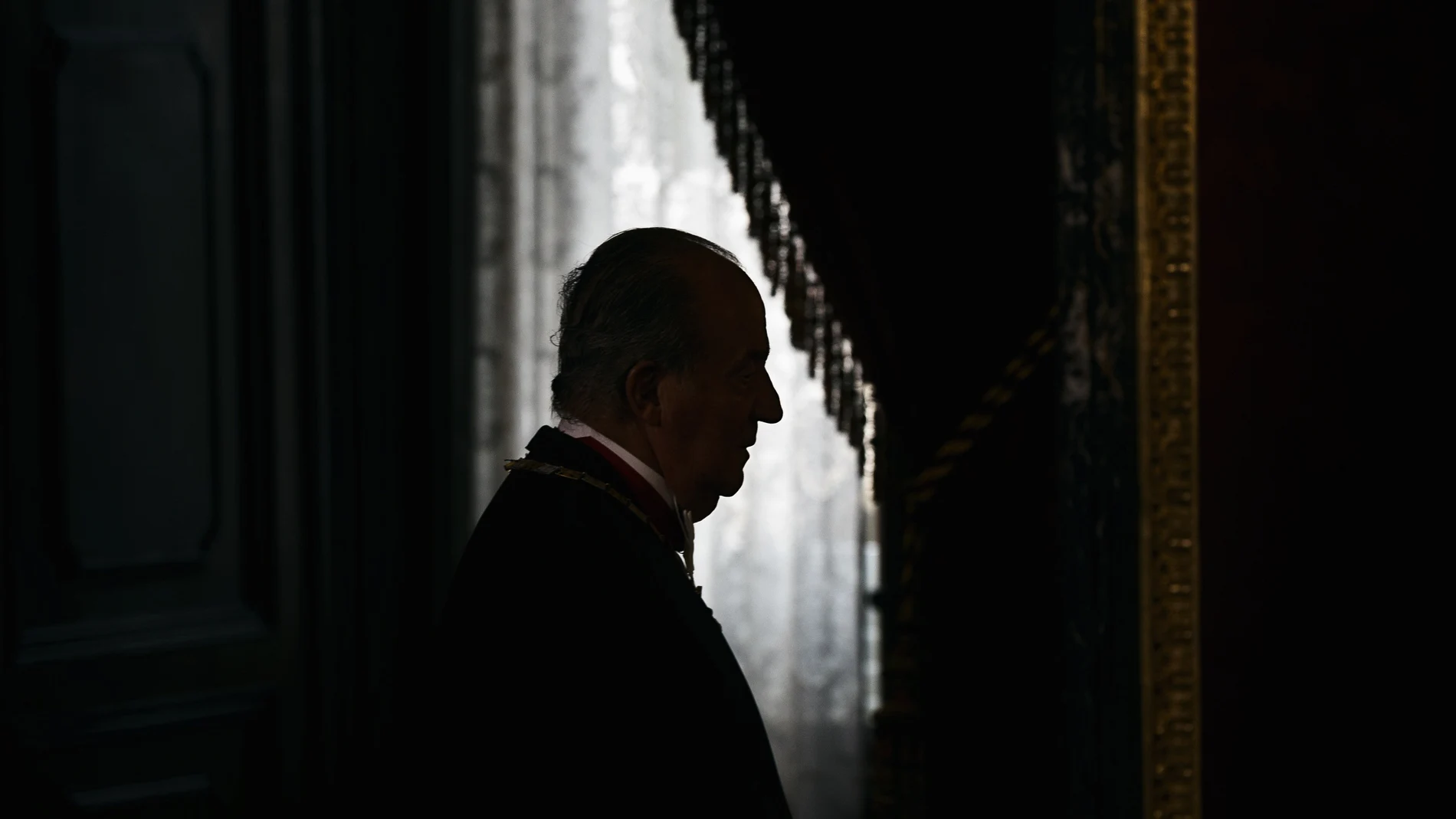 Spain's King Juan Carlos enters a room before a gala dinner for Mexico's President Enrique Pena Nieto at the Royal Palace.