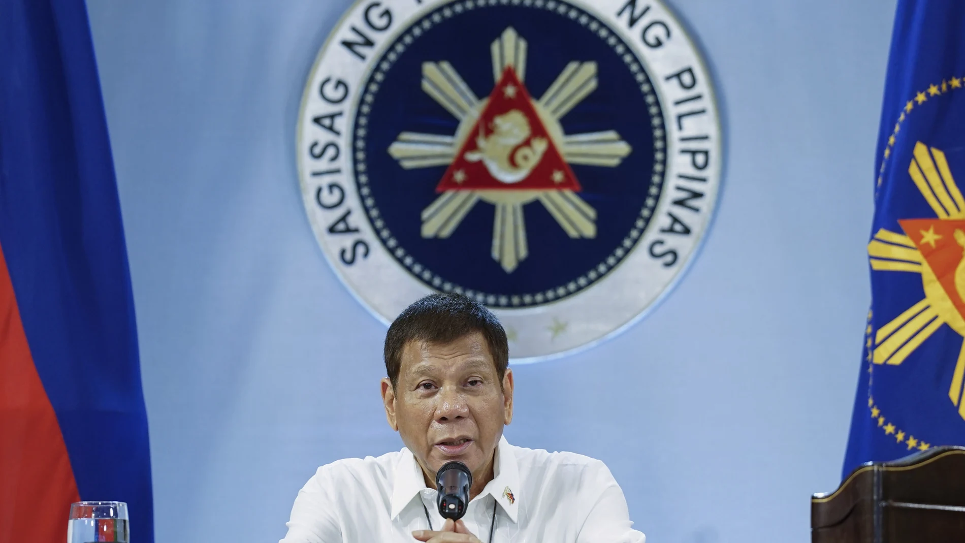 In this photo provided by the Malacanang Presidential Photographers Division, Philippine President Rodrigo Duterte gestures as he meets members of the Inter-Agency Task Force on the Emerging Infectious Diseases at the Malacanang presidential palace in Manila, Philippines on Monday Dec. 7, 2020. The Philippine president has ruled out any ceasefire and a resumption of long-stalled peace talks with communist guerrillas and renewed a vow to destroy the insurgents in his last two years in office. (King Rodriguez/Malacanang Presidential Photographers Division via AP)