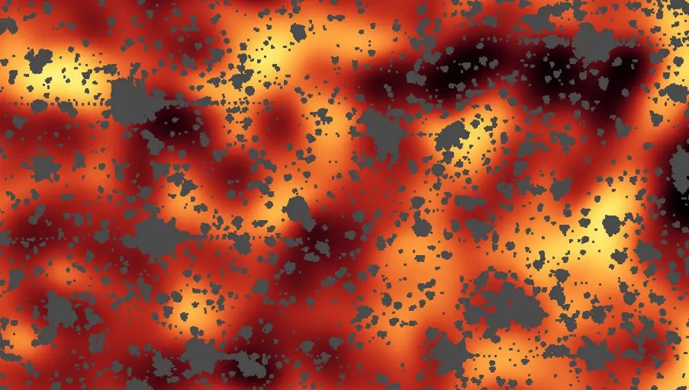 Esta imagen del telescopio infrarrojo Spitzer representa una pequeña región de la constelación de Draco (de 6×12 minutos de arco) observada en el infrarrojo medio, a 3,8 micras. Las manchas grises son estrellas, galaxias, y errores del aparato que se han eliminado para que no distraigan la vista. Todo lo restante es luz infrarroja de fondo, cuyo origen no conocemos en detalle pero que podría provenir de galaxias extremadamente jóvenes o incluso de las estrellas de primera generación.