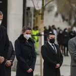 Spain&#39;s King Felipe VI, left, Queen Letizia, second left, and Spain&#39;s Health Minister Salvador Illa, right, attend the unveiling of a monument to late health workers during the coronavirus pandemic in Madrid, Spain, Friday, Dec. 18, 2020. (AP Photo/Manu Fernanez, Pool)