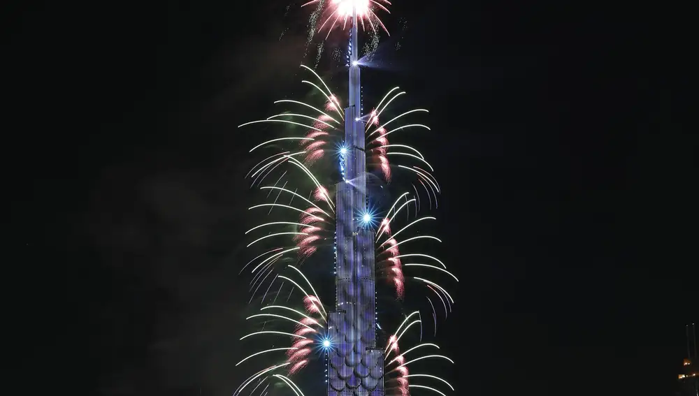 Fireworks explode from the Burj Khalifa, the world's tallest building, to mark New Year in Dubai, United Arab Emirates, Friday, Jan. 1, 2021. (AP Photo/Kamran Jebreili)