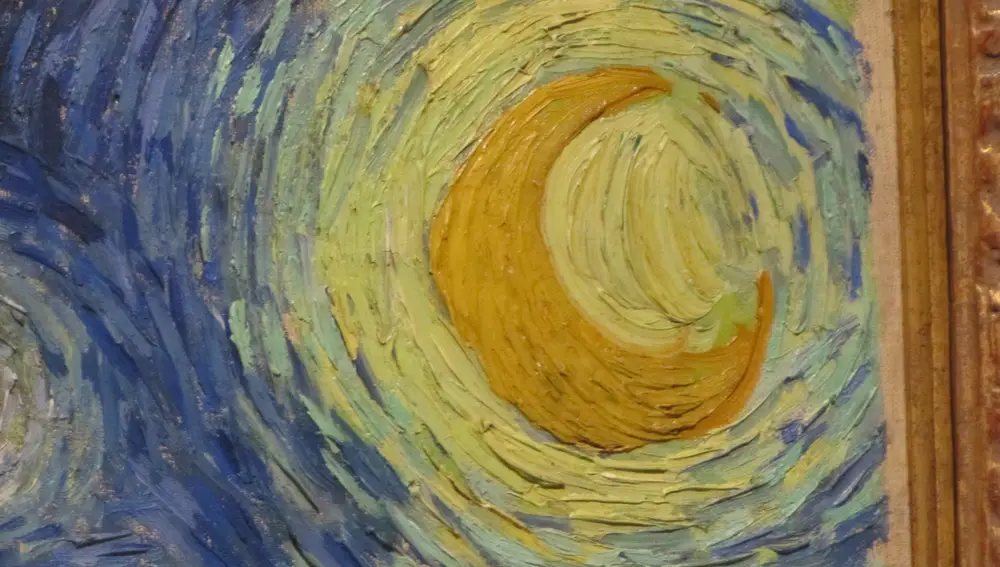 Detalle del cuadro Noche Estrellada de Vicent Van Gogh. La luna esta pintada con Amarillo de Calcuta.
