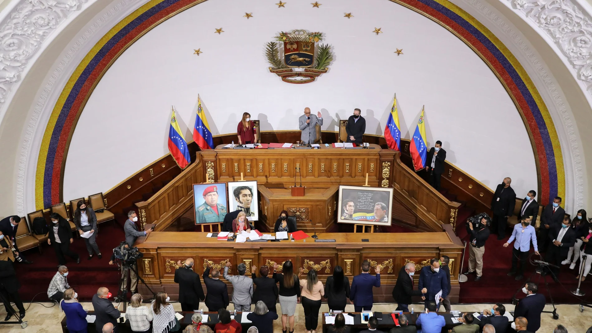 Venezuela's new National Assembly members raise their hands during a session in Caracas, Venezuela January 7, 2021. REUTERS/Manaure Quintero