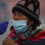 A doctor collects a sample for coronavirus testing in La Paz, Bolivia, Friday, Jan. 8, 2021. (AP Photo/Juan Karita)