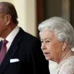 FILE - In this Thursday, Nov. 3, 2016 file photo, Britain&#39;s Prince Philip and Queen Elizabeth II bid farewell to Colombia&#39;s President Juan Manuel Santos, and his wife Maria Clemencia de Santos, following their state visit, at Buckingham Palace in London. Queen Elizabeth II and her husband have received their COVID-19 vaccinations. Buckingham Palace officials said in a statement that the 94-year-old monarch and 99-year-old Prince Philip received their jabs on Saturday, Jan. 9, 2021, joining some 1.5 million people in Britain who have been given the first dose of a vaccine against the coronavirus. (Stefan Wermuth/Pool Photo via AP, File)