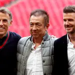 Phil Neville, Peter Lim y David Beckham.
