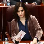La presidenta de la Comunidad de Madrid, Isabel Díaz Ayuso, durante una sesión extraordinaria en la Asamblea de Madrid