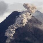 Hot cloud of volcanic materials run down the slope of Mount Merapi during an eruption in Sleman, Wednesday, Jan. 27, 2021. Indonesia's most active volcano erupted Wednesday with a river of lava and searing gas clouds flowing 1,500 meters (4,900 feet) down its slopes. (AP Photo/Slamet Riyadi)