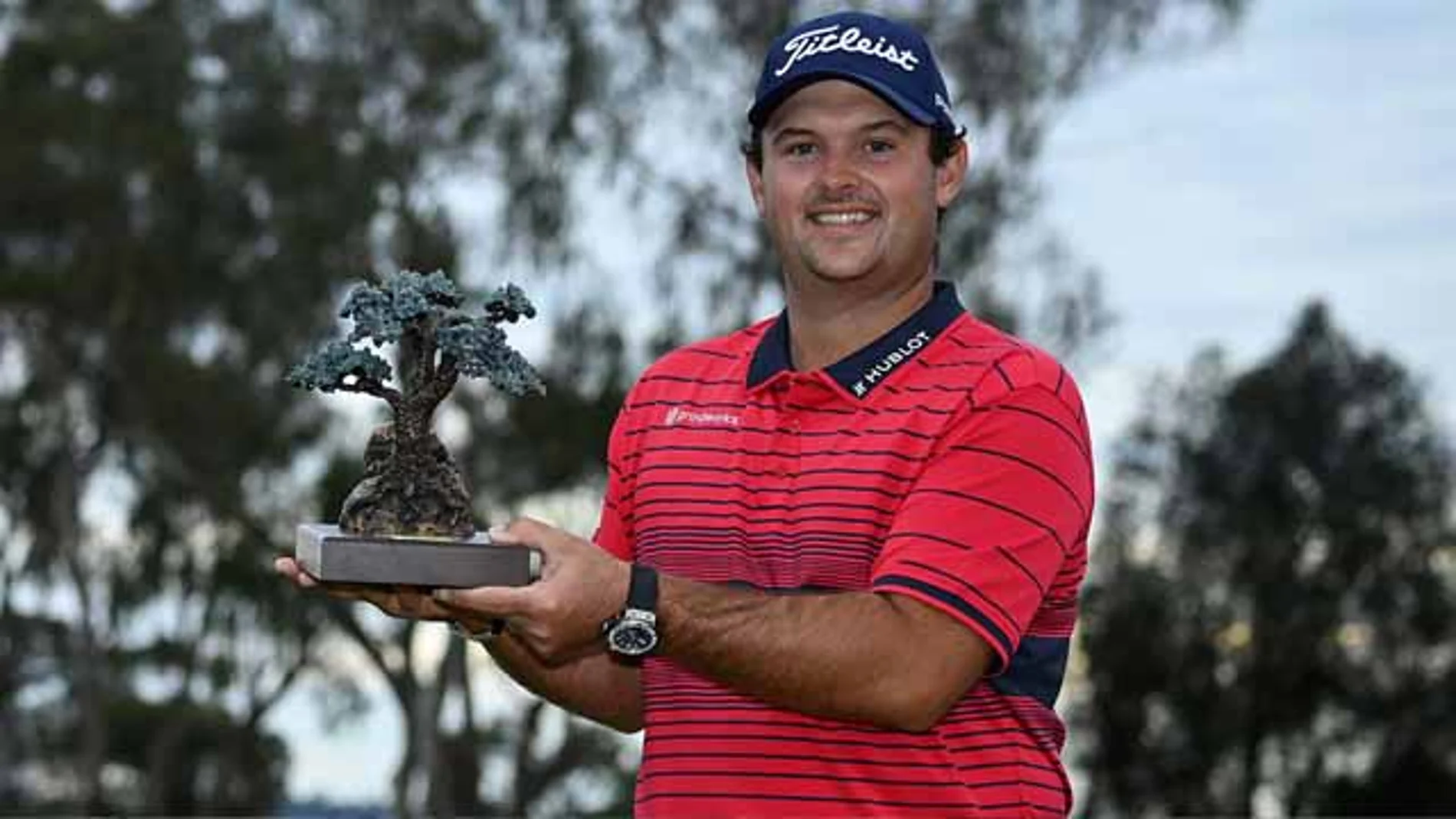 Patrick Reed, con el trofeo