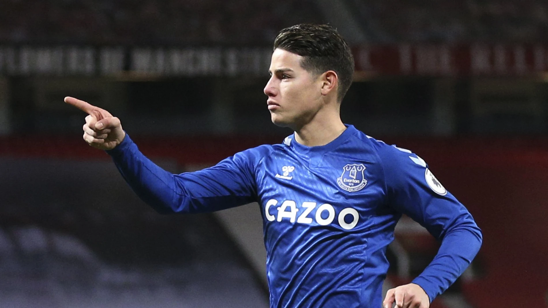 Everton's James Rodriguez celebrates after scoring his side's second goal during an English Premier League soccer match between Manchester United and Everton at the Old Trafford stadium in Manchester, England, Saturday Feb. 6, 2021. (Alex Pantling/Pool via AP)