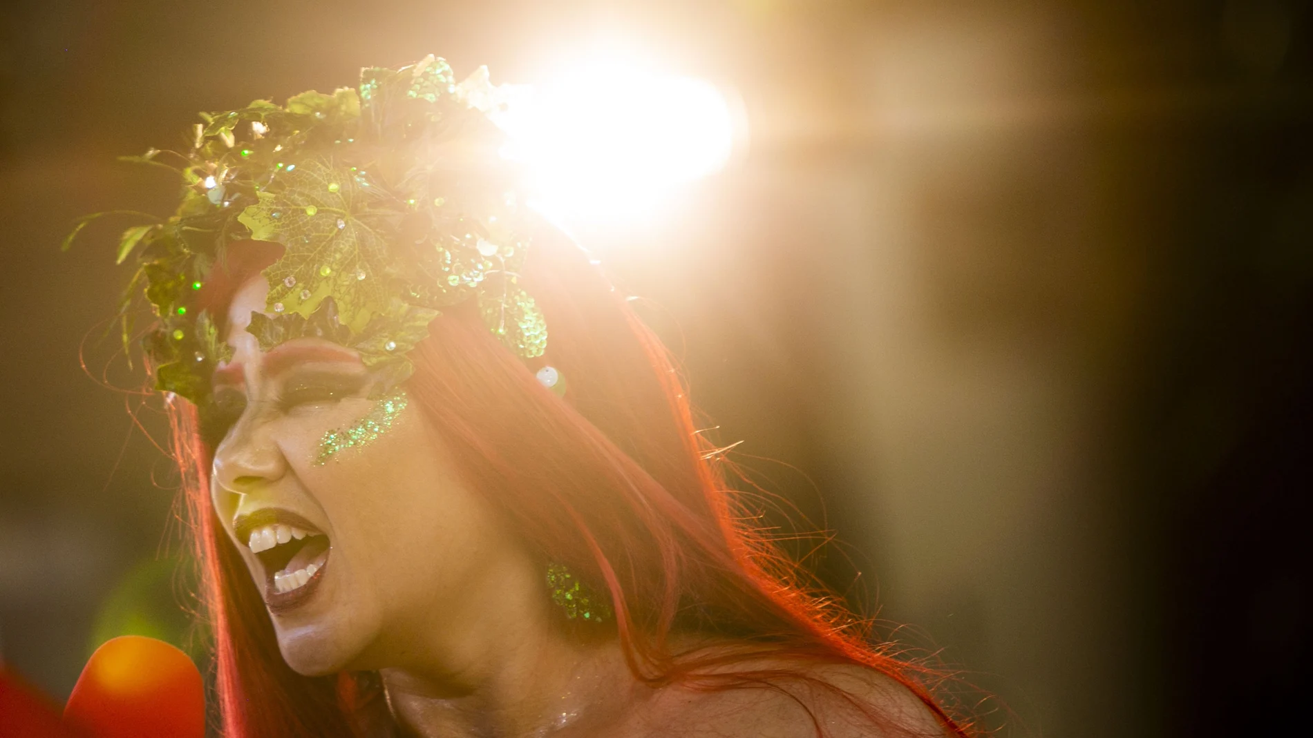 A woman performs in the "Desliga da Justica" block party in Rio de Janeiro, Brazil, Sunday, Feb. 14, 2021. The party was broadcast live on social media for those who were unable to participate in the carnival due to COVID restrictions after the city's government officially suspended Carnival and banned street parades or clandestine parties. (AP Photo/Bruna Prado)