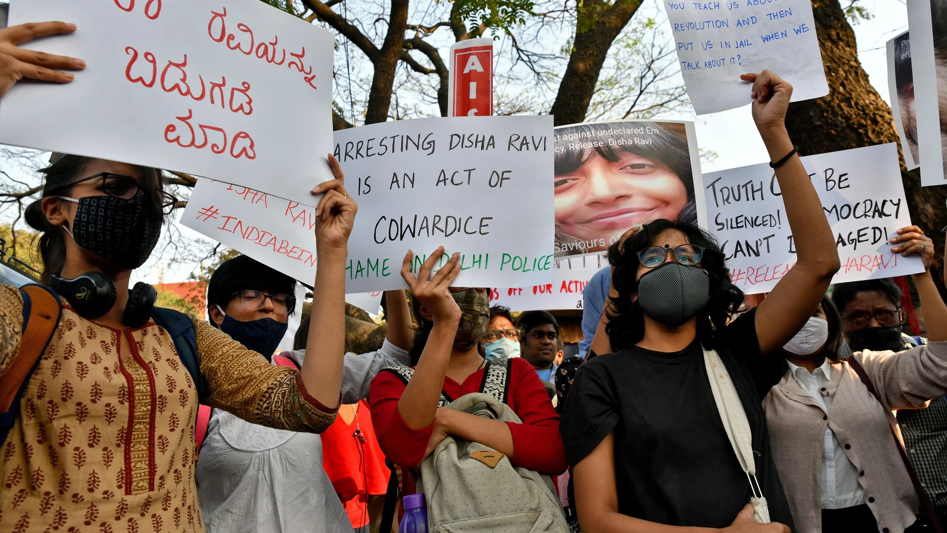 People hold placards during a protest against the arrest of 22-year-old climate activist Disha Ravi, in Bengaluru, India, February 15, 2021. REUTERS/Samuel Rajkumar