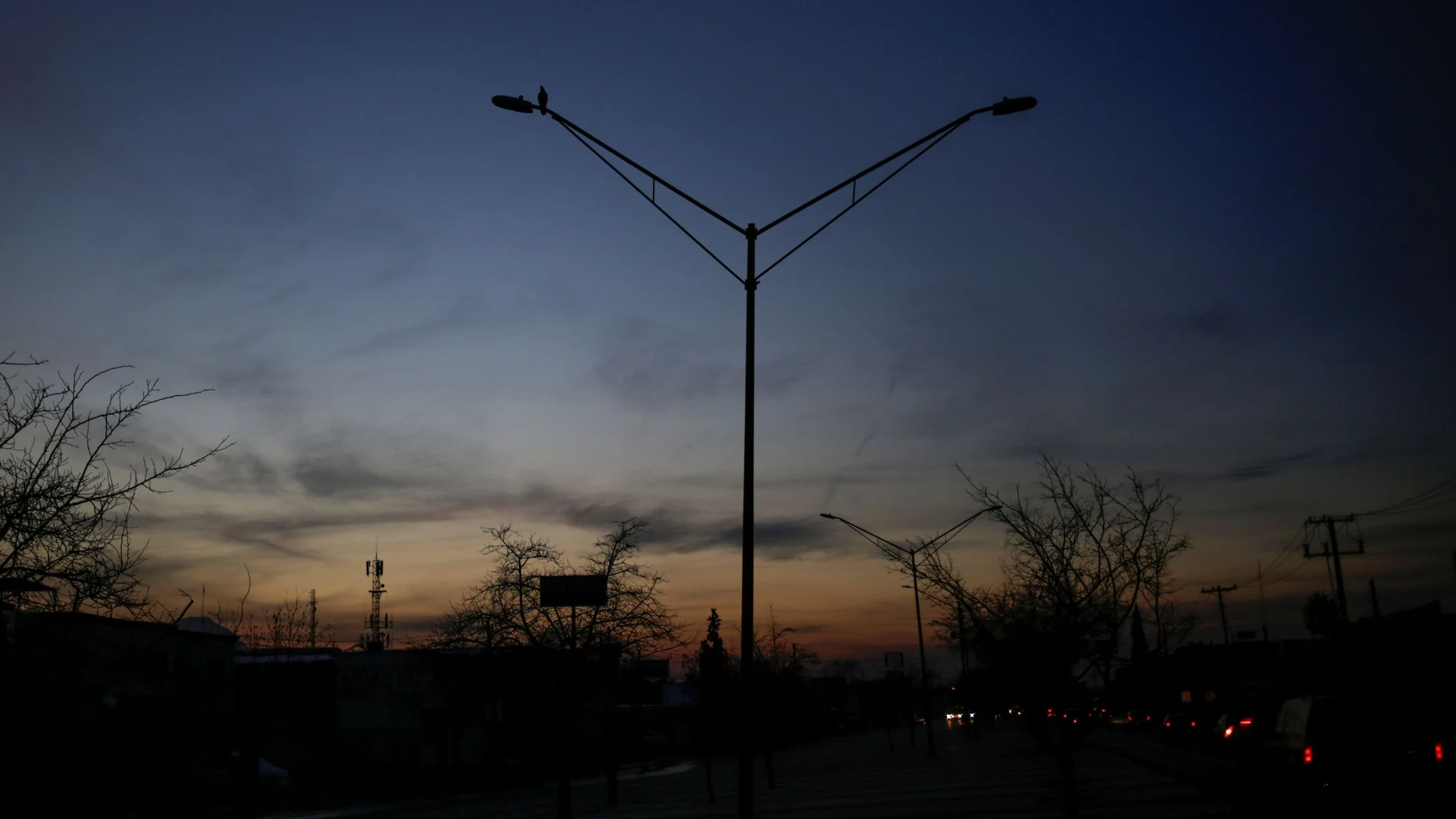 Light poles are pictured without power during an outage in Mexico's electricity network, in Ciudad Juarez, Mexico February 15, 2021. REUTERS/Jose Luis Gonzalez
