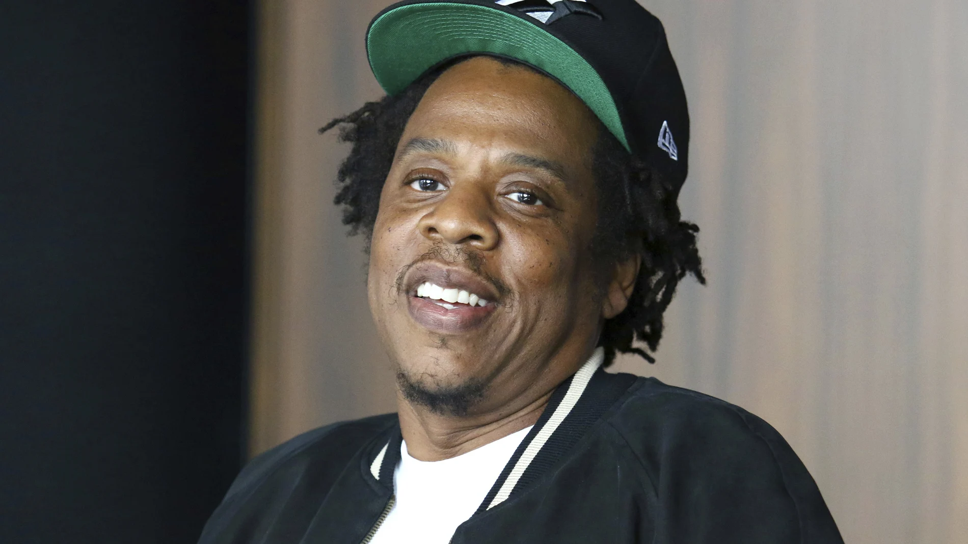 FILE - In this July 23, 2019, file photo, Jay-Z makes an announcement of the launch of Dream Chasers record label in joint venture with Roc Nation, at the Roc Nation headquarters in New York. Moet Hennessy is acquiring a 50% stake in the rapper and entrepreneur's Champagne brand, Armand de Brignac, in an effort to up its cool factor and expand sales. Jay-Z, whose real name is Shawn Carter, said the partnership will help Armand de Brignac grow and flourish.Â Â (Photo by Greg Allen/Invision/AP, File)