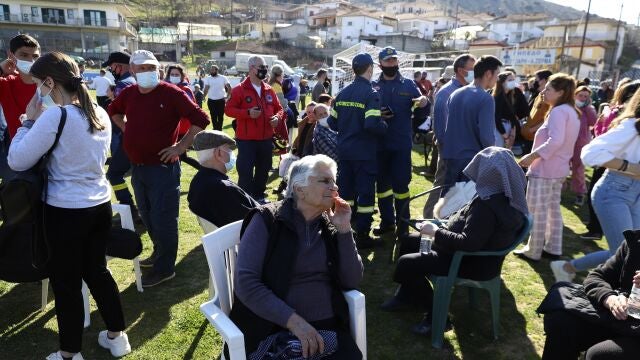 Local residents gather at a soccer field after an earthquake in Mesochori village, central Greece, Wednesday, March 3, 2021. An earthquake with a preliminary magnitude of up to 6.3 struck central Greece on Wednesday and was felt as far away as the capitals of neighboring Albania, North Macedonia, Kosovo and Montenegro. (AP Photo/Vaggelis Kousioras)